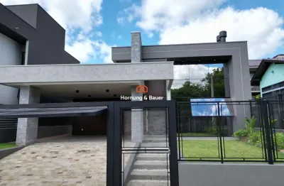 Casa nova à venda em ivoti no loteamento carolina-com três suítes, lareira e espaço gourmet.