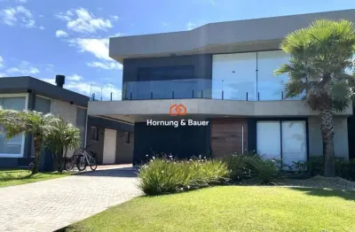 Casa de alto padrão à venda no condomínio costa serena em capão da canoa