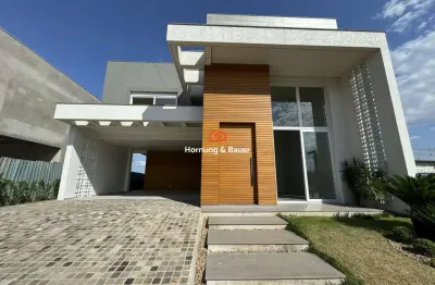 Casa à venda em condomínio fechado, nelsi haas no centro de portão - com três suítes e piscina.