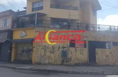 Prédio comercial com 02 salões e 02 aptos que pode ser usado como moradia ou escritório.