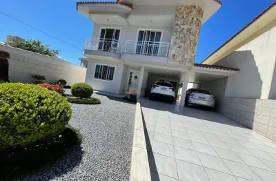 Casa com 3 quartos à venda na rua graciliano carlos de quadros, 64, centro, palhoça por r$ 1.060.000