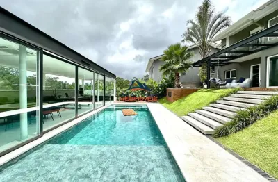 Casa para venda no condomínio parque das artes com 4 suítes com armários e bancadas, ar condicionados e painéis para tv, repleto de moveis planejados