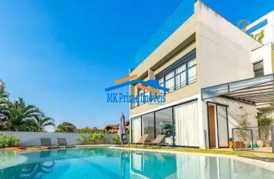 Casa luxuosa com 3 piscinas no eco boulevard - jardim petropólis/sp.