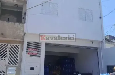 ** terreno com 3 casas + 1 espaço comercial a venda na vila brasilina.