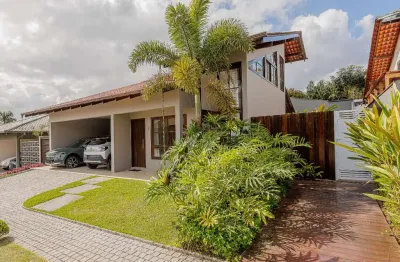 Casa térrea com mezanino em condomínio no glória, joinville-sc: 4 quartos, 2 suítes 256,26 m².