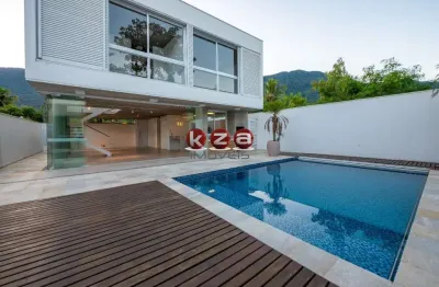 Imóvel de luxo à venda em são sebastião-sp: casa na praia de guaecá com 4 suítes, 3 salas, amplo gourmet e piscina, ao lado do mar.