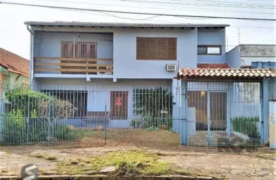 Casa com 3 quartos à venda na Rua Vítor Valpírio, 539, Anchieta, Porto Alegre
