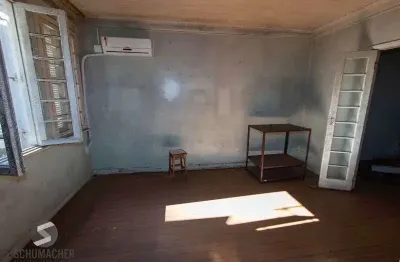 Casa com 5 quartos à venda na Rua Tiradentes, 168, Independência, Porto Alegre