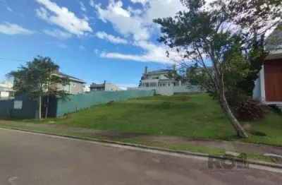 Terreno em condominio em porto alegre, no bairro vila nova, à venda.