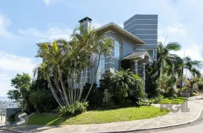 Casa em condomínio fechado com 4 quartos à venda na Rua Alcebíades Antônio dos Santos, 444, Nonoai, Porto Alegre