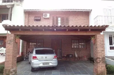 Casa em condomínio fechado com 3 quartos à venda na Avenida Juca Batista, 1524, Cavalhada, Porto Alegre