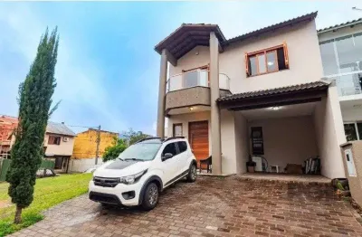 Casa em condomínio fechado com 3 quartos à venda na Rua Deputado Hugo Mardini, 1842, Passo das Pedras, Porto Alegre