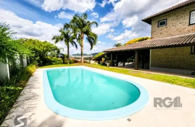 Casa em condomínio fechado com 5 quartos à venda na Avenida Firmino Octávio Bimbi, 321, Cavalhada, Porto Alegre