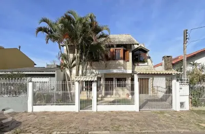 Casa com 4 quartos à venda na Avenida Guarujá, 199, Guarujá, Porto Alegre