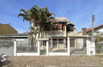Casa com 4 quartos à venda na Avenida Guarujá, 199, Guarujá, Porto Alegre