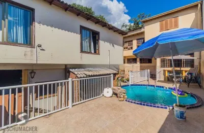 Casa com 4 quartos à venda na Rua Xavier da Cunha, 653, Nonoai, Porto Alegre