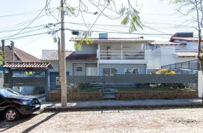 Casa 3 dormitórios no bairro tristeza com 2 vagas de garagem