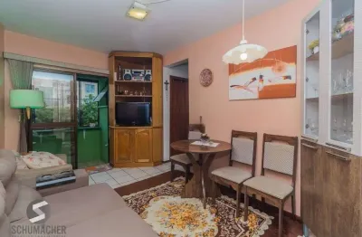 Apartamento iluminado com 2 dormitórios e vaga escriturada