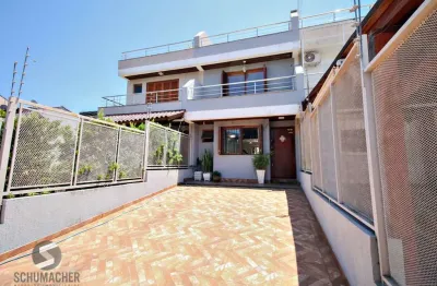 Casa com 3 quartos à venda na Rua Heitor Kramer, 369, Guarujá, Porto Alegre