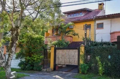 Casa com 3 quartos à venda na Rua Mura, 213, Guarujá, Porto Alegre