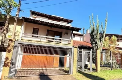 Casa com 3 quartos à venda na Rua Henrique Scliar, 359, Jardim Planalto, Porto Alegre