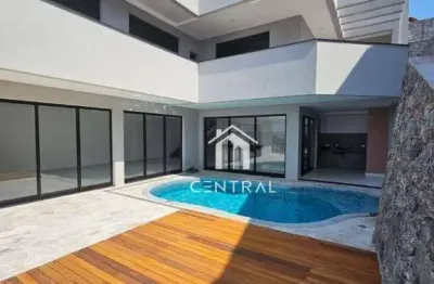Casa em condomínio de alto padrão à venda, com 3 dormitórios sendo 3 suítes, área gourmet com piscina e cozinha, 6 vagas de garagem!