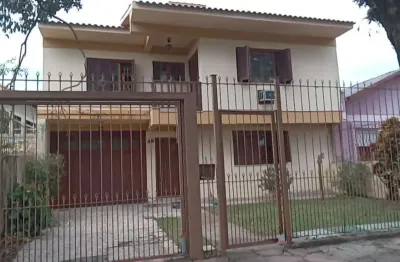 Casa com 3 quartos à venda na Avenida Cruz Alta, 416, Nonoai, Porto Alegre