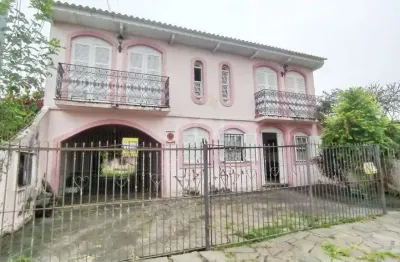 Casa com 3 quartos à venda na Rua Jacipuia, 332, Guarujá, Porto Alegre