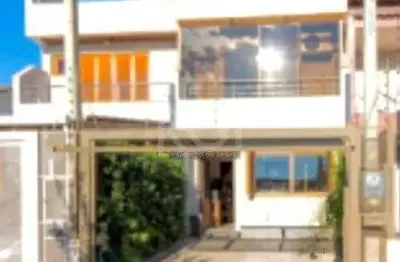 Casa com 3 quartos à venda na Rua Waldemar da Silva Tavares, 234, Guarujá, Porto Alegre