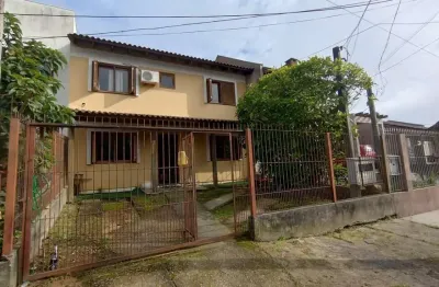Casa com 4 quartos à venda na Rua Doutor Cláudio Walter Ferreira da Silva, 191, Guarujá, Porto Alegre