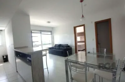 Apartamento mobiliado, 57m2, 1 suite, 1 vaga, lareira e churrasqueira, localizado no bairro três figueiras, porto alegre/rs.