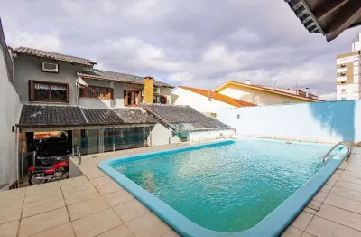 Casa de 4 dormitórios e 208m² à venda no bairro jardim botânico, porto alegre.