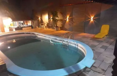 Sobrado com piscina e 3 dormitórios à venda, 240 m² por R$ 780.000 - Maracanã - Praia Grande/SP