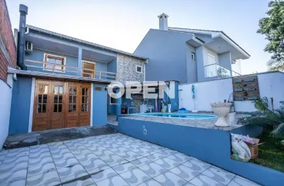 Sobrado 3 dormitórios com área gourmet, piscina e sacada à venda no bairro igara, canoas
