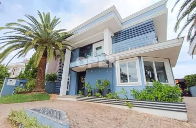 Casa em condomínio fechado de alto padrão 04 dormitórios sendo 03 suítes , bela vista , canoas .