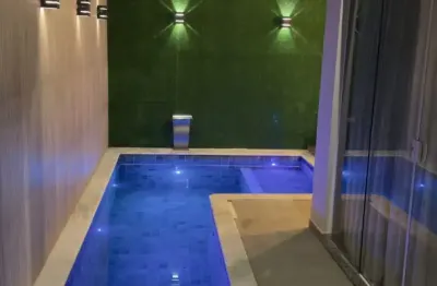 Linda casa com 3 suítes e piscina em condomínio no bairro Sim.