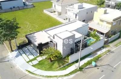Casa moderna no condomínio terras do vale com 3 suítes, pé direito duplo, piscina e área gourmet