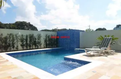 Casa para venda em condomínio de alto padrão em peruibe. 3 suítes, closet, sala ampla, cozinha planejada, linda área de lazer com piscina com cascata.