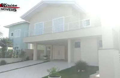 Sobrado em condomínio fechado em peruibe ,  condomínio frente para o mar , 4 suites com piscina