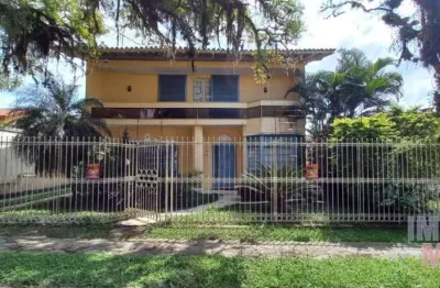 Casa com 3 quartos à venda na travessa trindade, 40, jardim lindóia, porto alegre por r$ 1.300.000