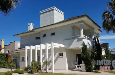 Casa em condomínio fechado com 6 quartos à venda na central, 2000, zona nova, capão da canoa por r$ 3.550.000