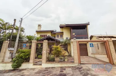 Casa com 4 quartos à venda na travessa porto príncipe, 59, jardim lindóia, porto alegre por r$ 1.645.000
