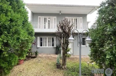 Casa com 3 quartos à venda na Rua Rossini, 95, São Sebastião, Porto Alegre por R$ 1.060.000