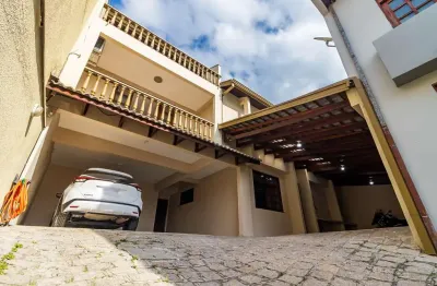 Casa com 4 quartos à venda na rua vadeco suit, 42, uberaba, curitiba por r$ 985.000