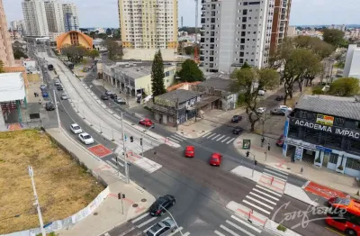 Terreno à venda na avenida república argentina, 5504, novo mundo, curitiba por r$ 1.300.000