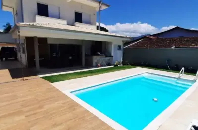 Casa com 4 quartos à venda no jardim britânia, caraguatatuba  por r$ 1.650.000