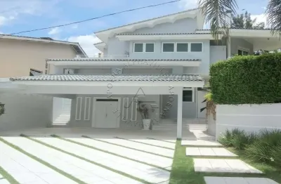 Casa em condomínio fechado com 4 quartos para alugar na alameda das tulipas, 30, alphaville, santana de parnaíba por r$ 18.000