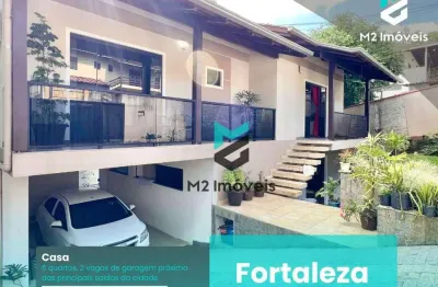 Descubra seu novo lar na fortaleza, em uma residência espaçosa de 304m²! com dois andares de elegância e um amplo quintal!