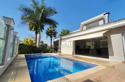 Casa térrea de alto padrão para venda ou locação no condomínio damha i com área construída de 394 m² | 5 suítes, sauna úmida e 6 vagas de garagem.