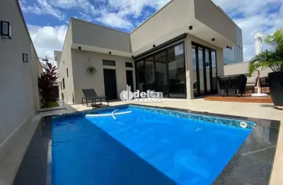 Casa em condomínio com 3 suítes no bairro laranjeiras em uberlândia - mg.